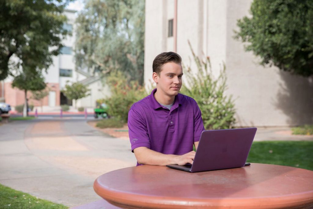 GCU Student at computer